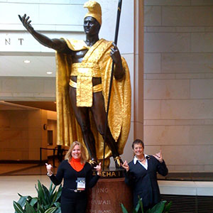 NHH advocates standing in front of a statue of King Kamehameha